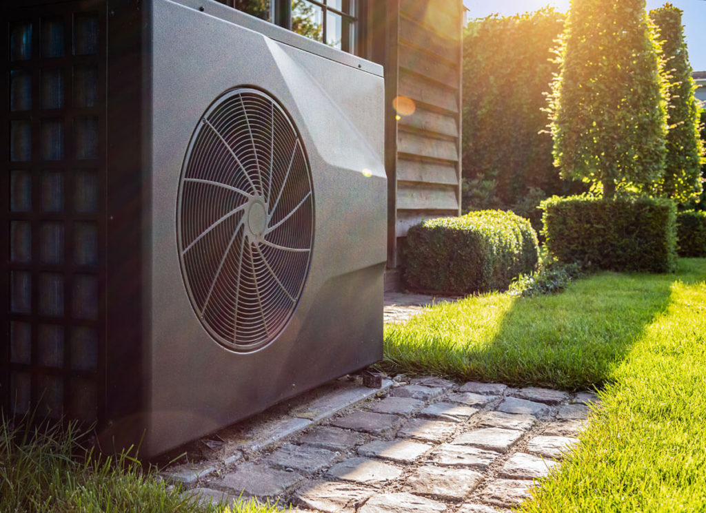 Air heat pump near pool house outdoors