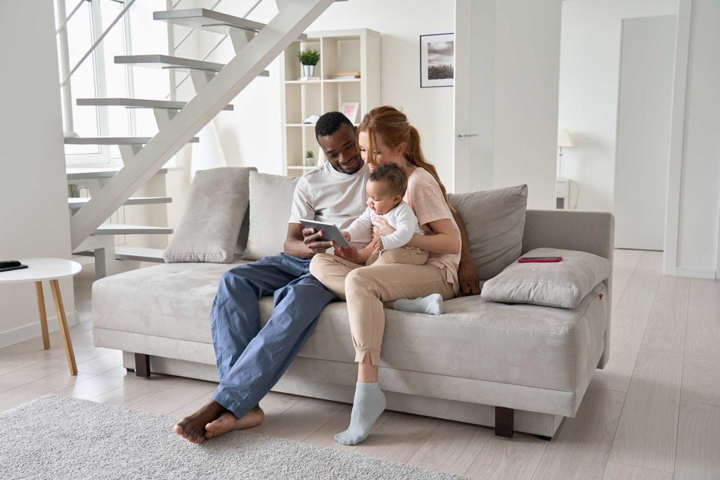 a couple with a child looking over the application process