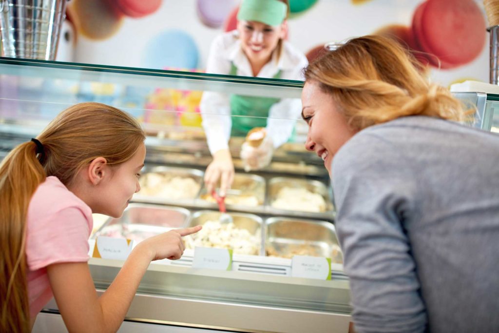 family going to get ice cream at a cafe