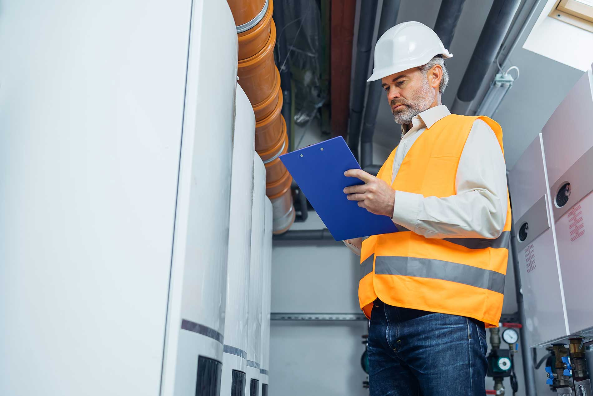 technician looking at commercial boilers offering flexibility